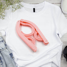 Portable folding clothes hangers for various garments, ideal for travel.